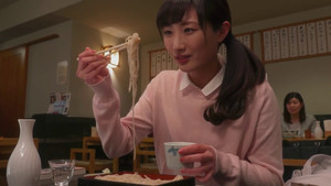 A woman drinking alone at a soba restaurant
