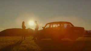 Two drivers at sunset